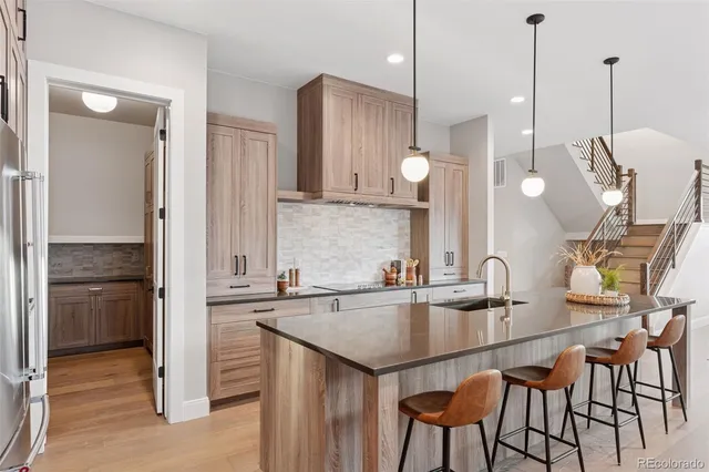a kitchen with a sink and cabinets