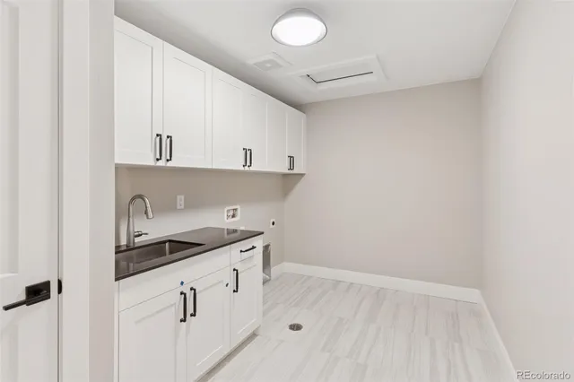 a kitchen with stainless steel appliances granite countertop a stove and a sink