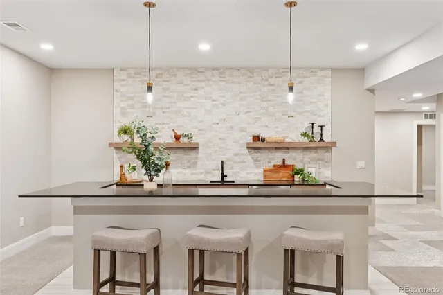 a kitchen with a sink and cabinets