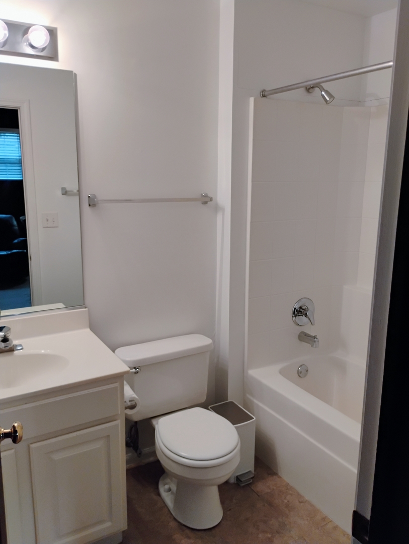 1166 Georgetown Way Vernon Hills, IL 60061 - Photo 35 of 36 a white toilet sitting next to a bath tub