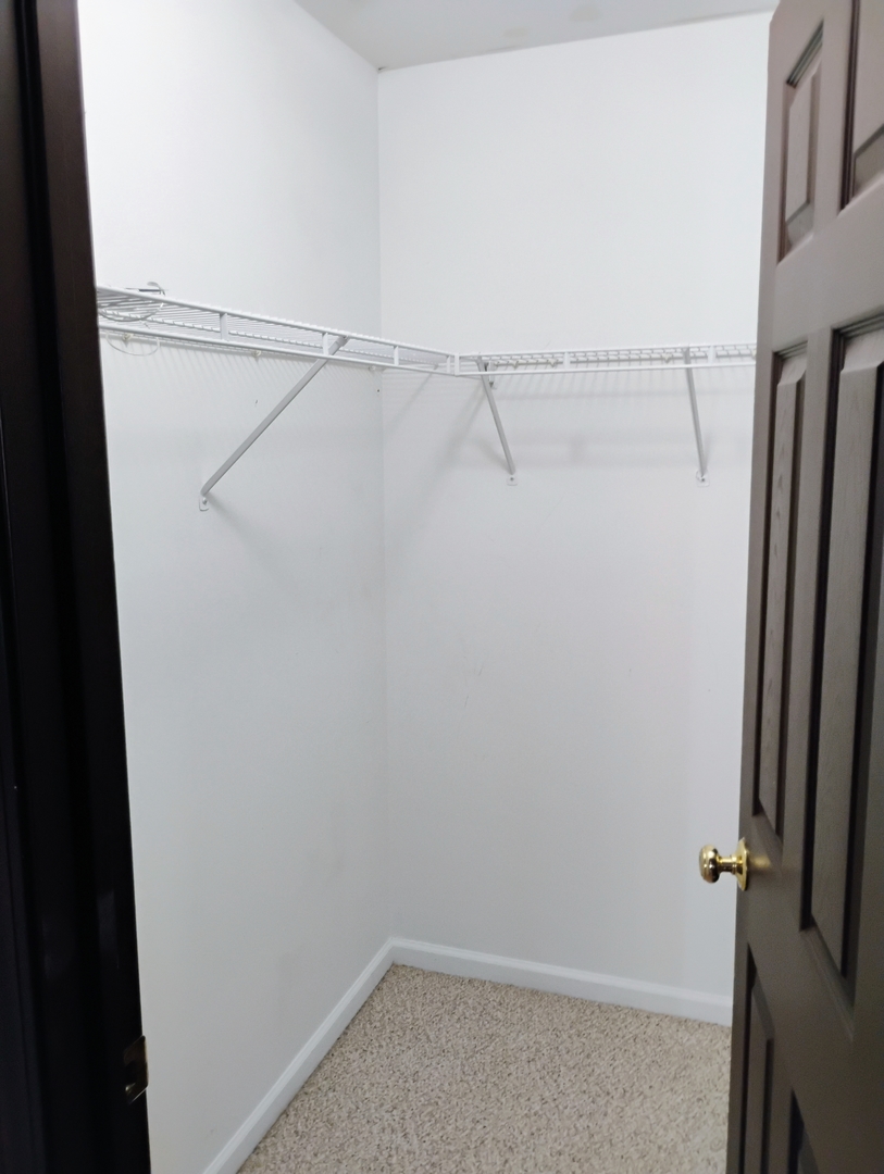 1166 Georgetown Way Vernon Hills, IL 60061 - Photo 36 of 36 a view of a room with racks on the wall