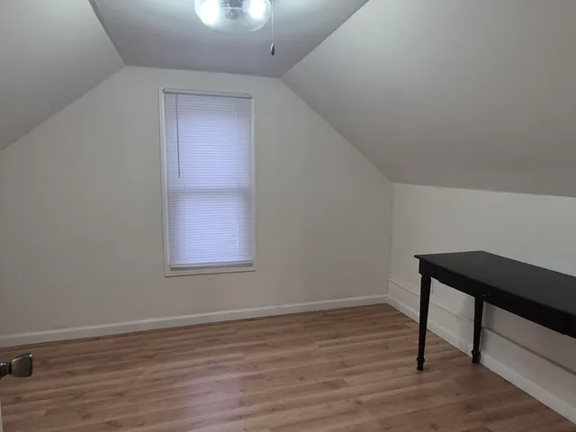 a bathroom with a tub and a shower