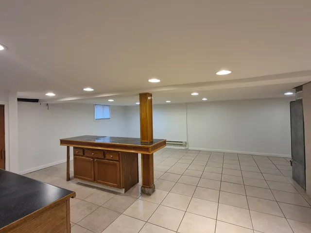 a bathroom with a toilet sink and shower