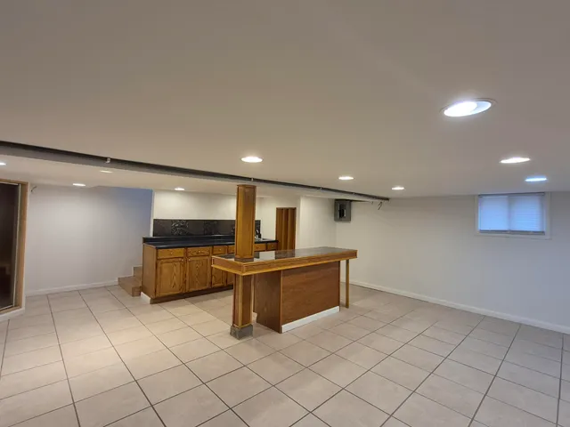 a stove top oven sitting inside of a kitchen