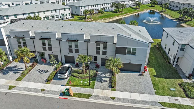 a view of multiple houses with a yard