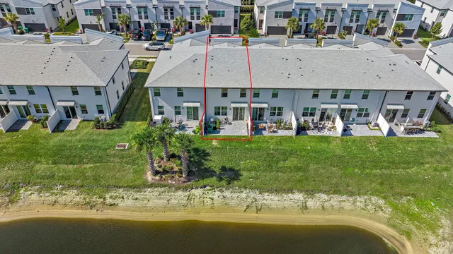 a aerial view of multiple houses with yard