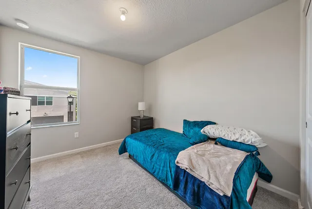 a bedroom with two beds and painted walls