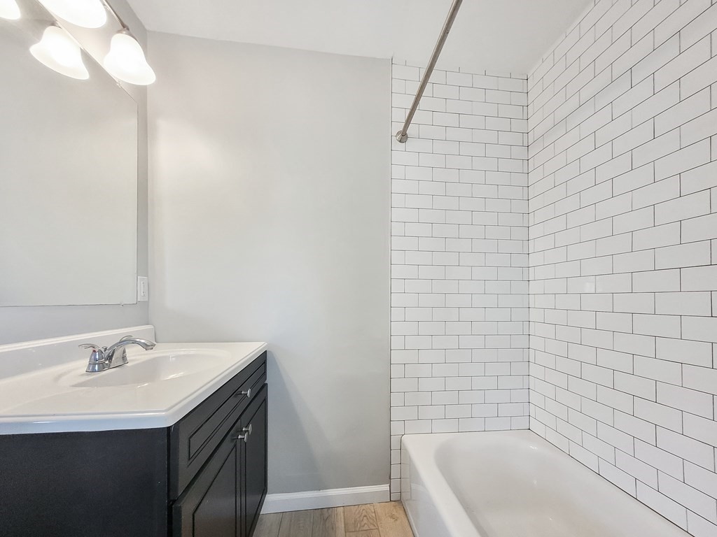 26 Arcadia Street, Unit 3R Boston, MA 02122 - Photo 5 of 8 a bathroom with a bathtub and a sink