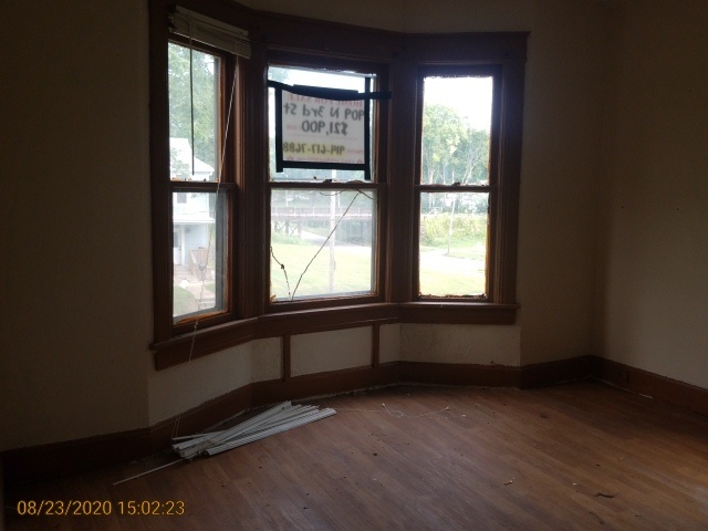 909 North 3rd Street Springfield, IL 62702 - Photo 14 of 22 an empty room with wooden floor and windows