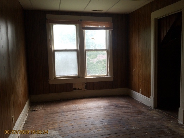 909 North 3rd Street Springfield, IL 62702 - Photo 17 of 22 a view of empty room with wooden floor and fan
