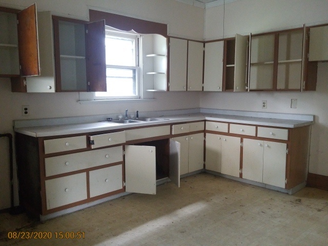 909 North 3rd Street Springfield, IL 62702 - Photo 9 of 22 a kitchen with a sink cabinets and window