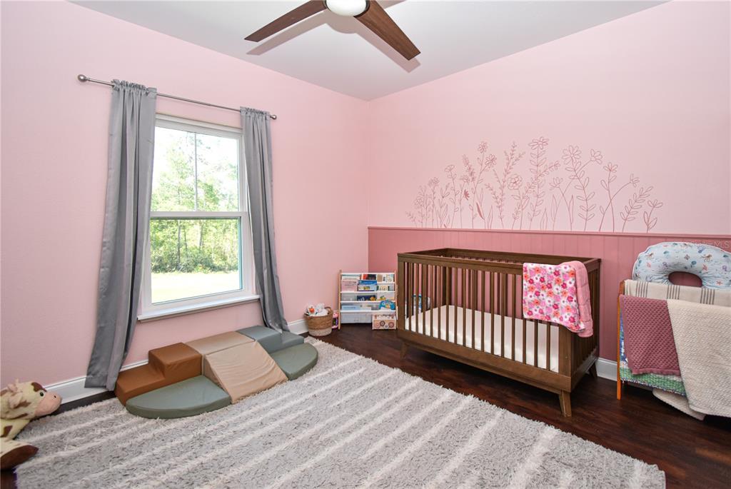 7890 Southwest 129th Avenue Cedar Key, FL 32625 - Photo 28 of 45 a bedroom with a bed and a window