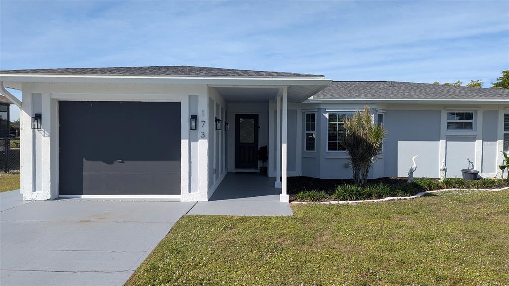 173 Rotonda Circle Rotonda West, FL 33947 - Photo 13 of 13 a front view of a house