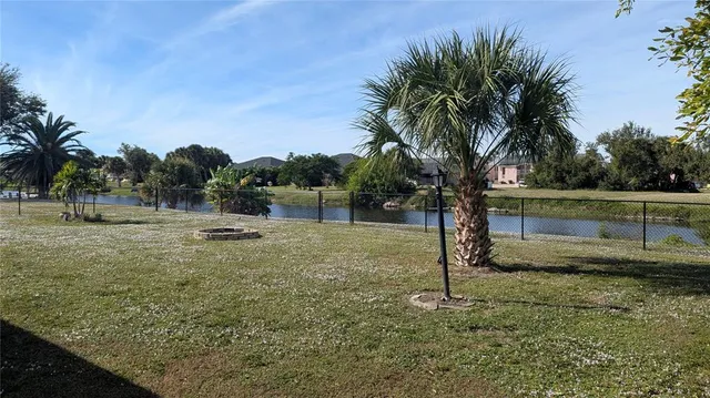 a view of a yard with a tree