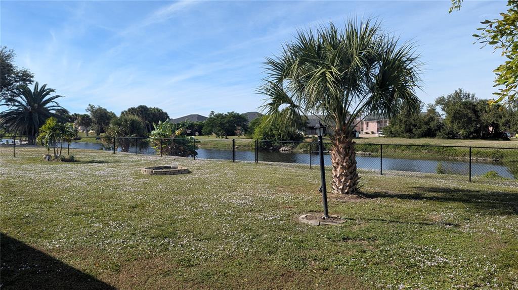 173 Rotonda Circle Rotonda West, FL 33947 - Photo 4 of 13 a view of a yard with a tree