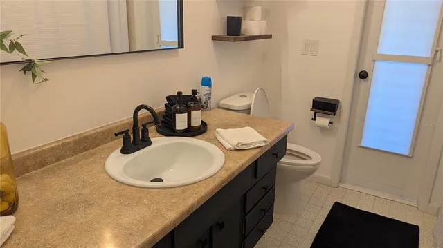 a bathroom with a sink and mirror