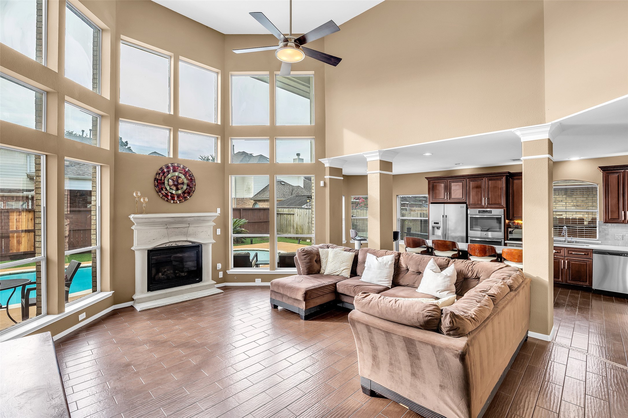611 River Delta Lane Rosenberg, TX 77469 - Photo 16 of 39 a living room with furniture large window and a fireplace