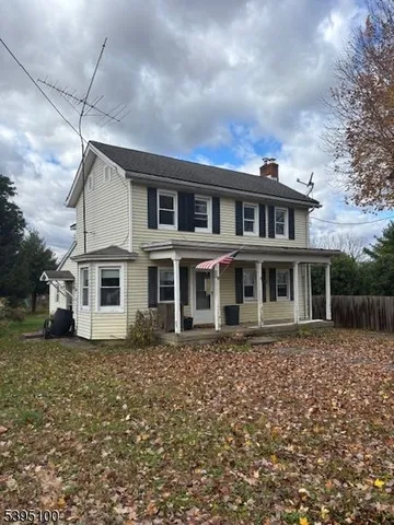 a house with trees in the background