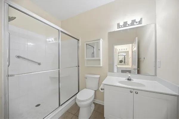 an aerial view of a swimming pool patio and outdoor seating