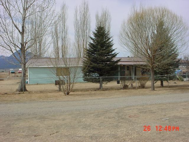 23860 F 4th Road Cortez, CO 81321 - Photo 3 of 5 a front view of a house with a yard