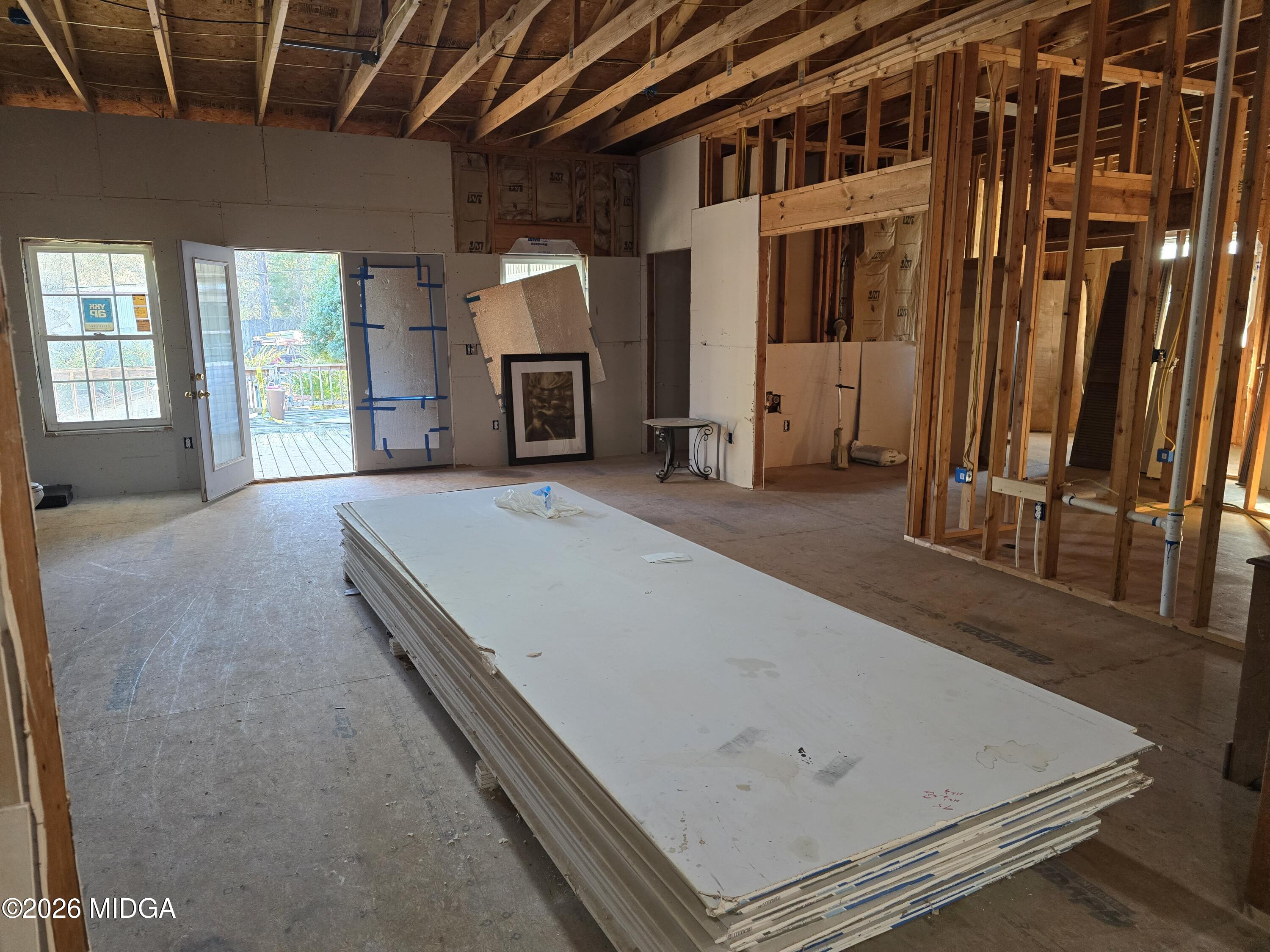 253 Pottery Road Lizella, GA 31052 - Photo 15 of 31 a living room with a bed furniture and a flat screen tv