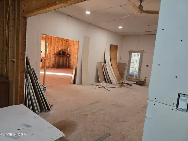 a white toilet sitting next to a shower curtain