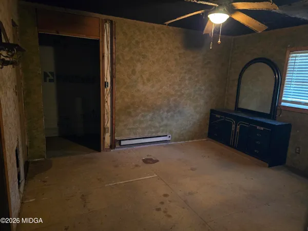 a kitchen with granite countertop wooden floors and sink