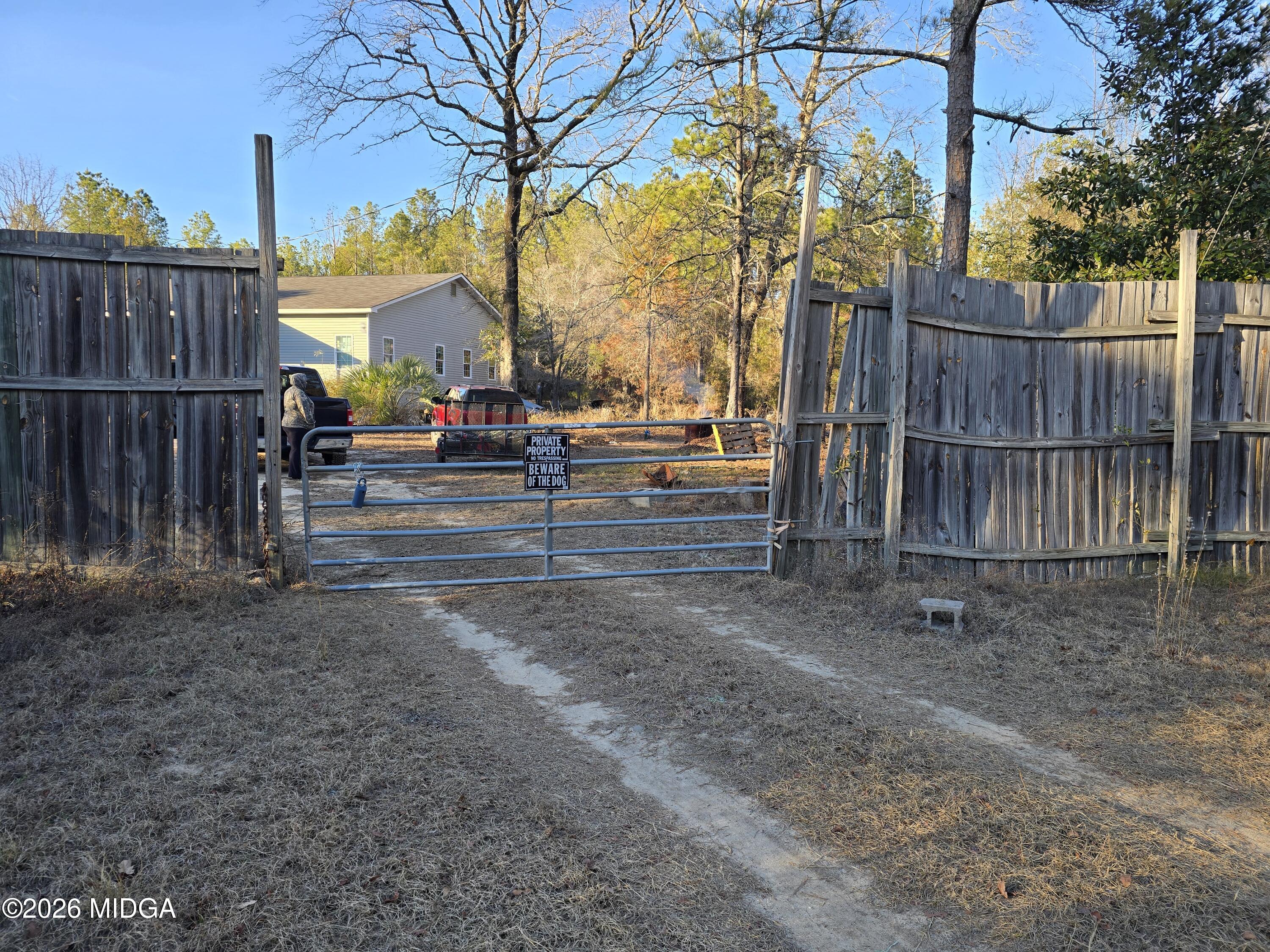 253 Pottery Road Lizella, GA 31052 - Photo 2 of 31 a view of a yard with wooden fence
