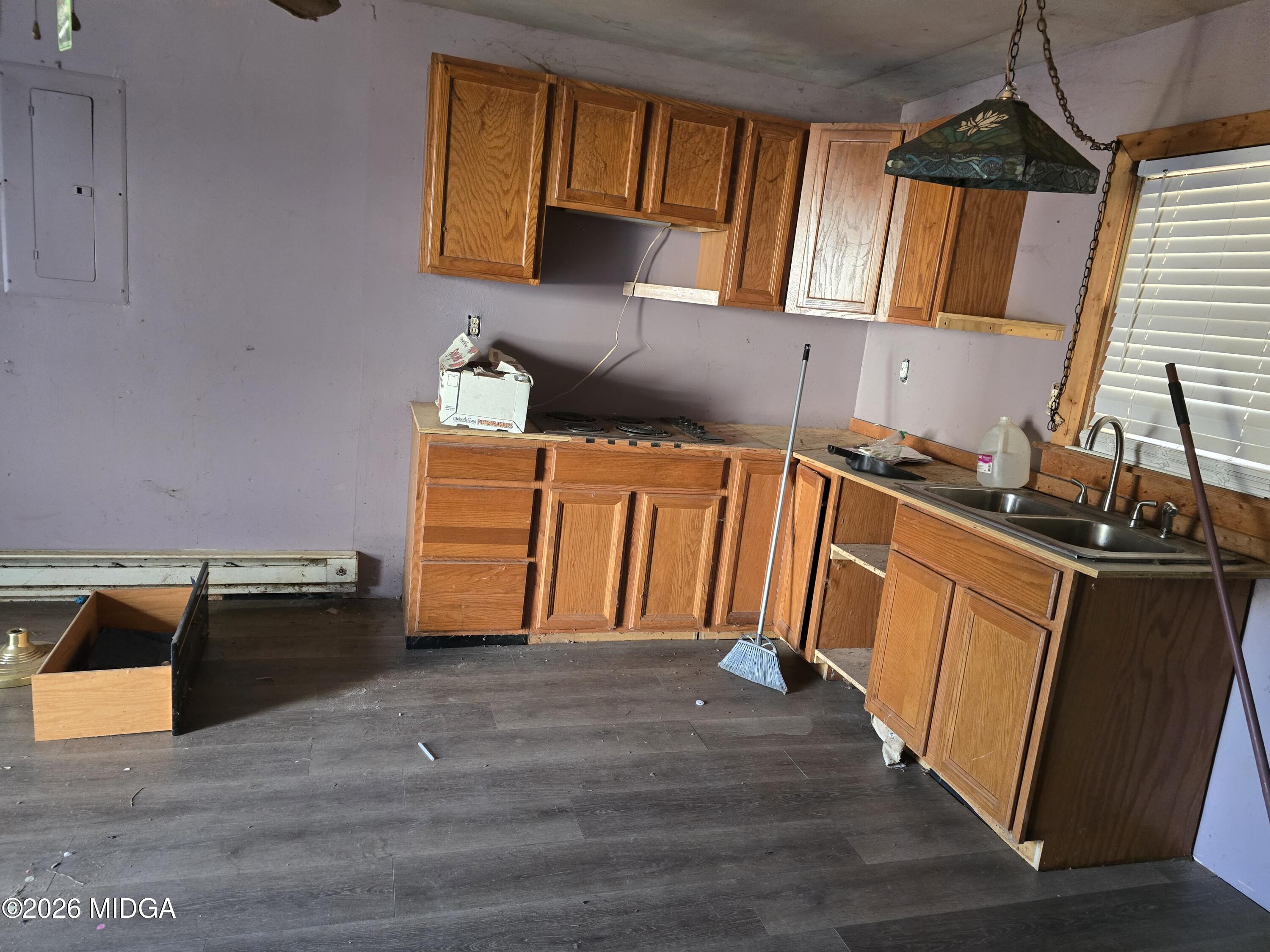 253 Pottery Road Lizella, GA 31052 - Photo 21 of 31 a kitchen with granite countertop wooden floors and sink