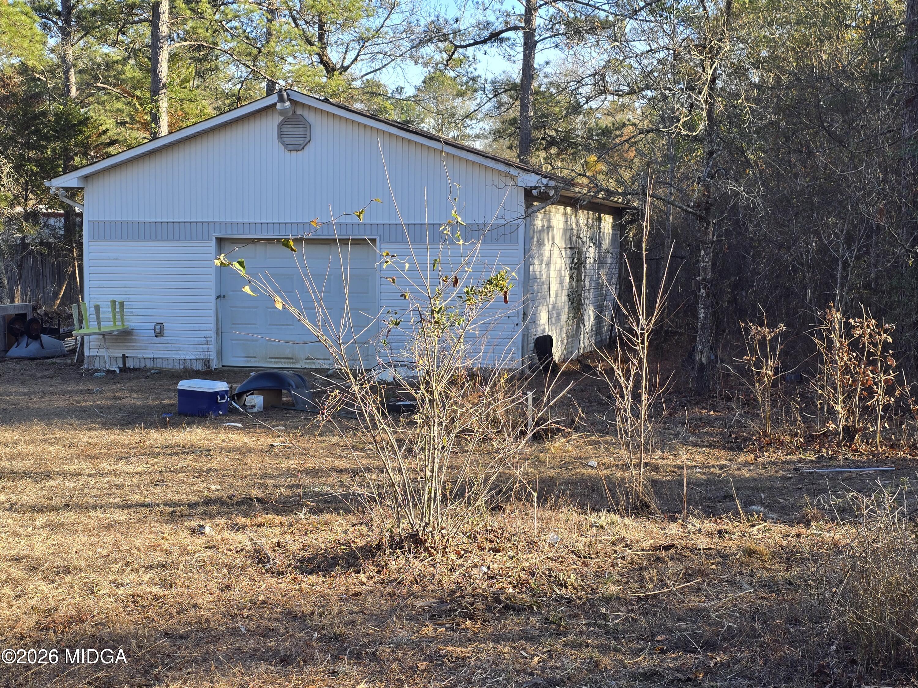 253 Pottery Road Lizella, GA 31052 - Photo 25 of 31 a view of a house with backyard and trees