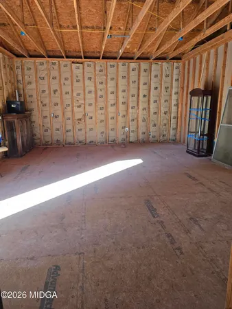 a view of a door with wooden fence