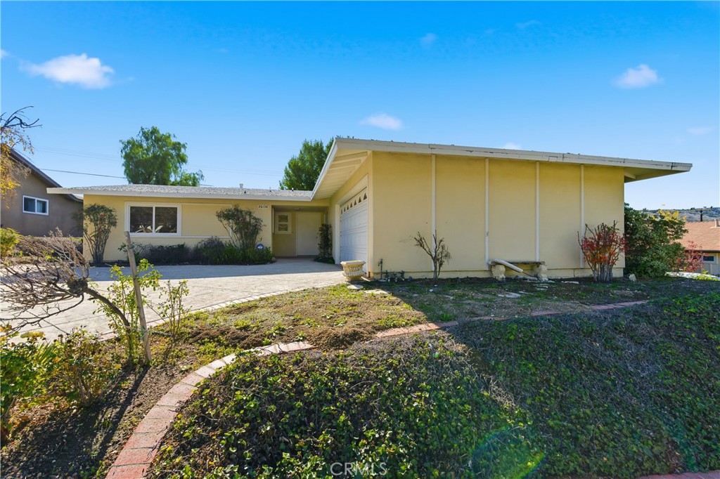 26136 Veva Way Calabasas, CA 91302 - Photo 2 of 22 a view of house with backyard