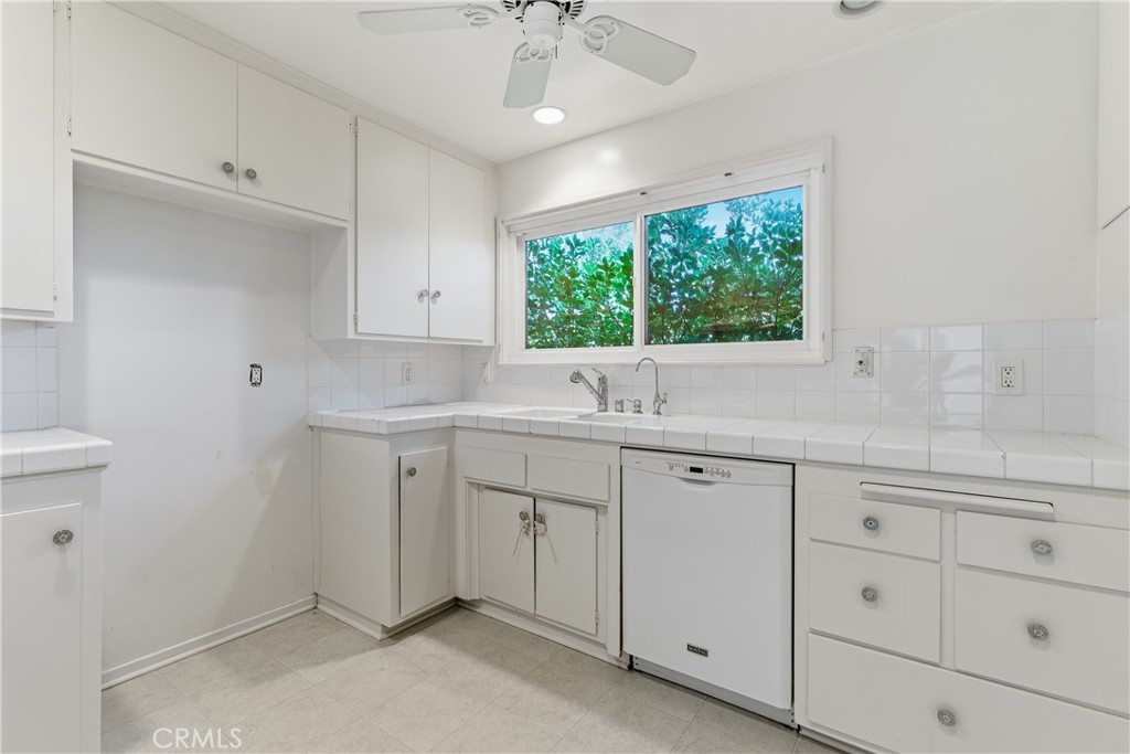 26136 Veva Way Calabasas, CA 91302 - Photo 6 of 22 a view with cabinets a sink and dishwasher