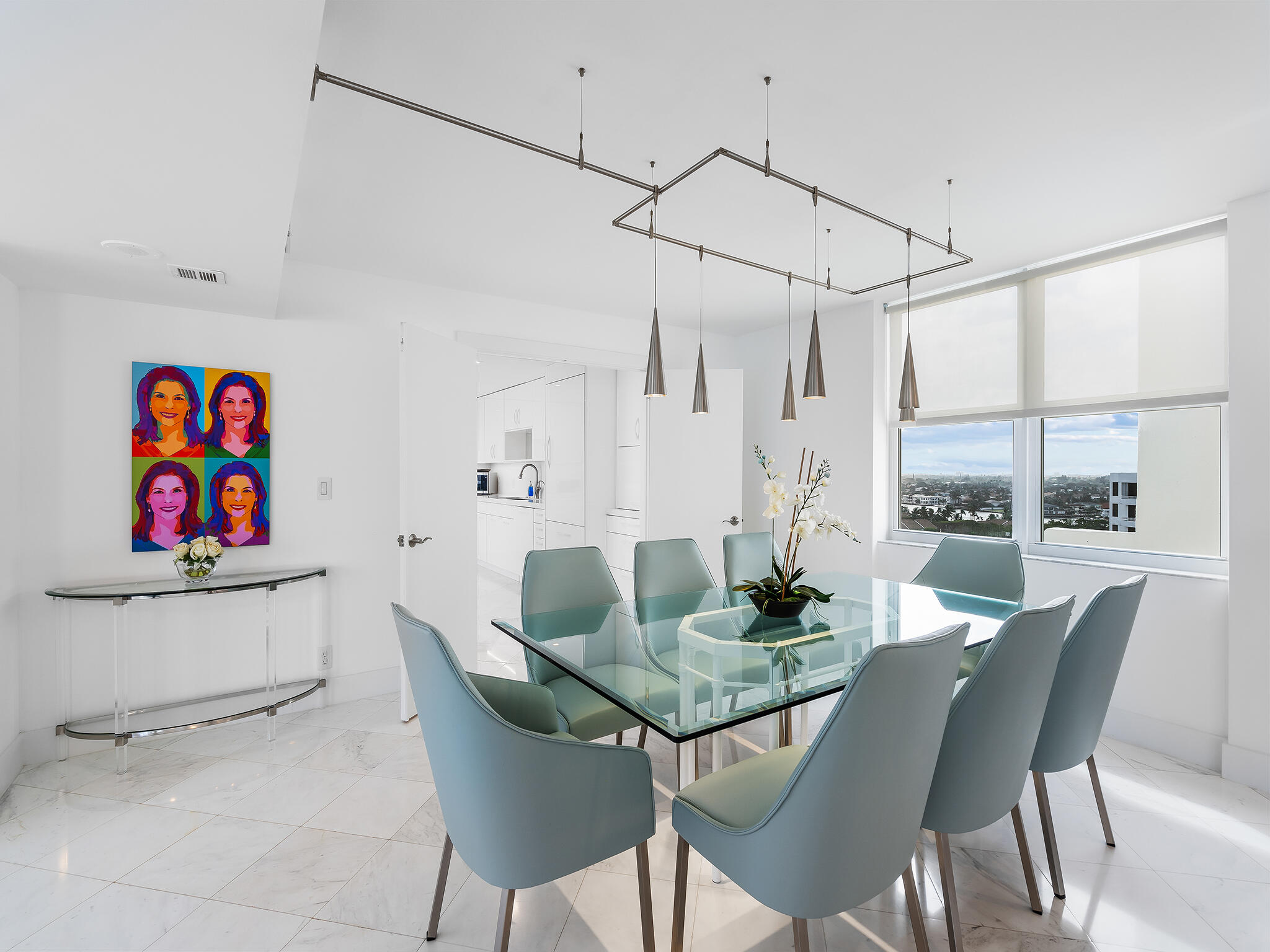 3407 South Ocean Boulevard, Unit PHB Highland Beach, FL 33487 - Photo 15 of 49 a dining room with furniture a rug and wooden floor