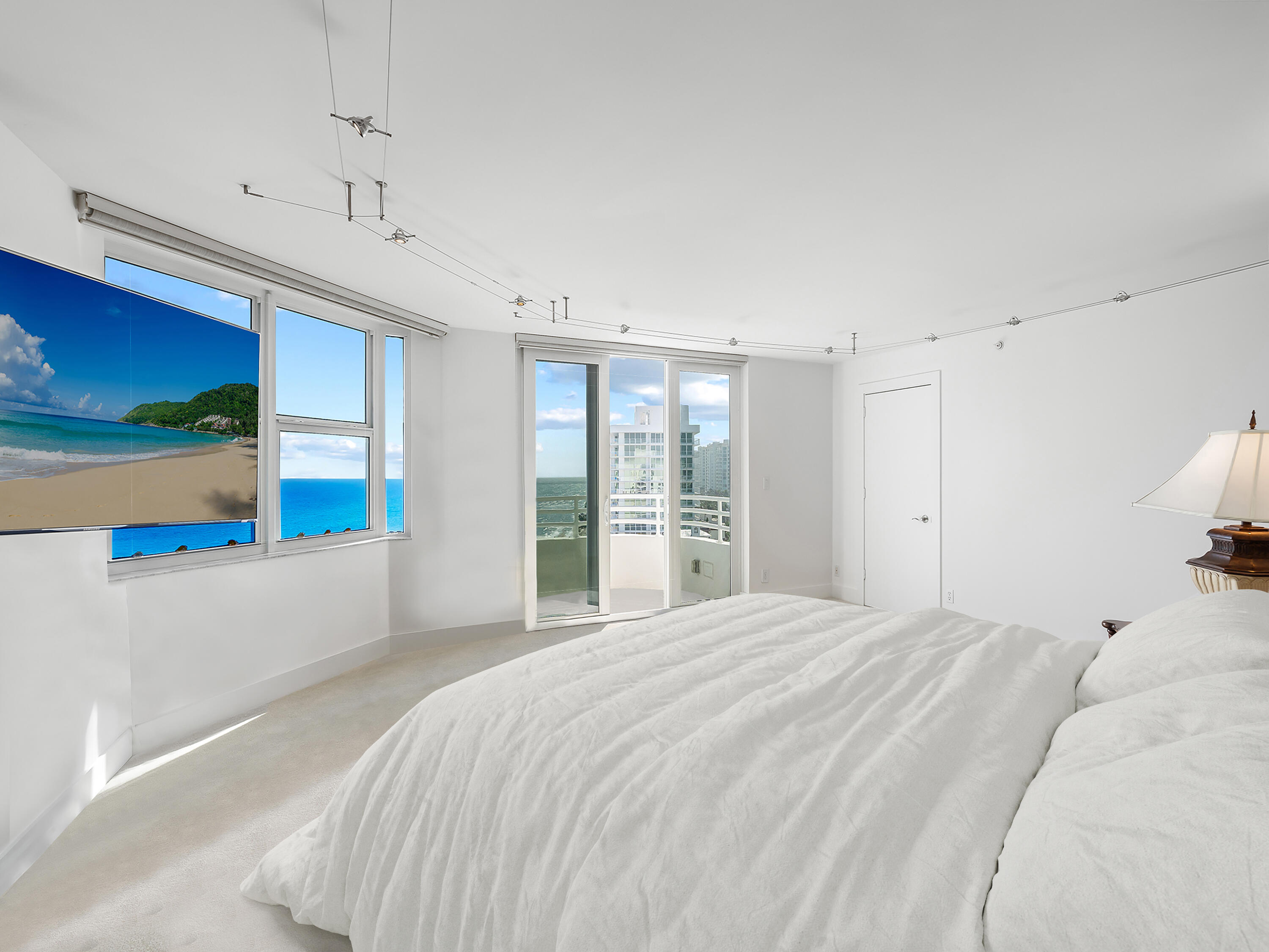 3407 South Ocean Boulevard, Unit PHB Highland Beach, FL 33487 - Photo 23 of 49 a large white bed in a white room