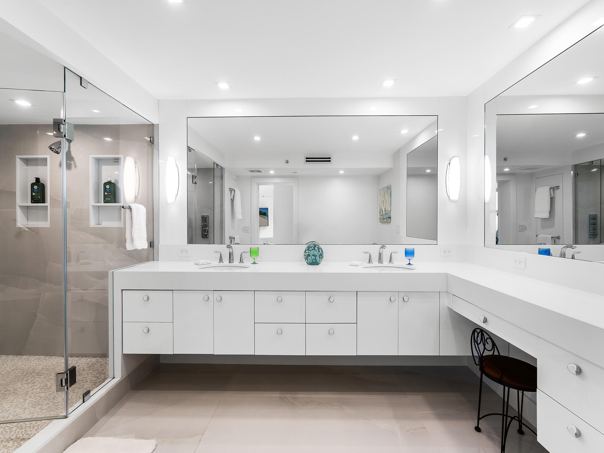 3407 South Ocean Boulevard, Unit PHB Highland Beach, FL 33487 - Photo 25 of 49 a large bathroom with a double vanity sink a mirror and a bathtub