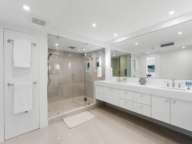 a bedroom with a bed a couch and a window