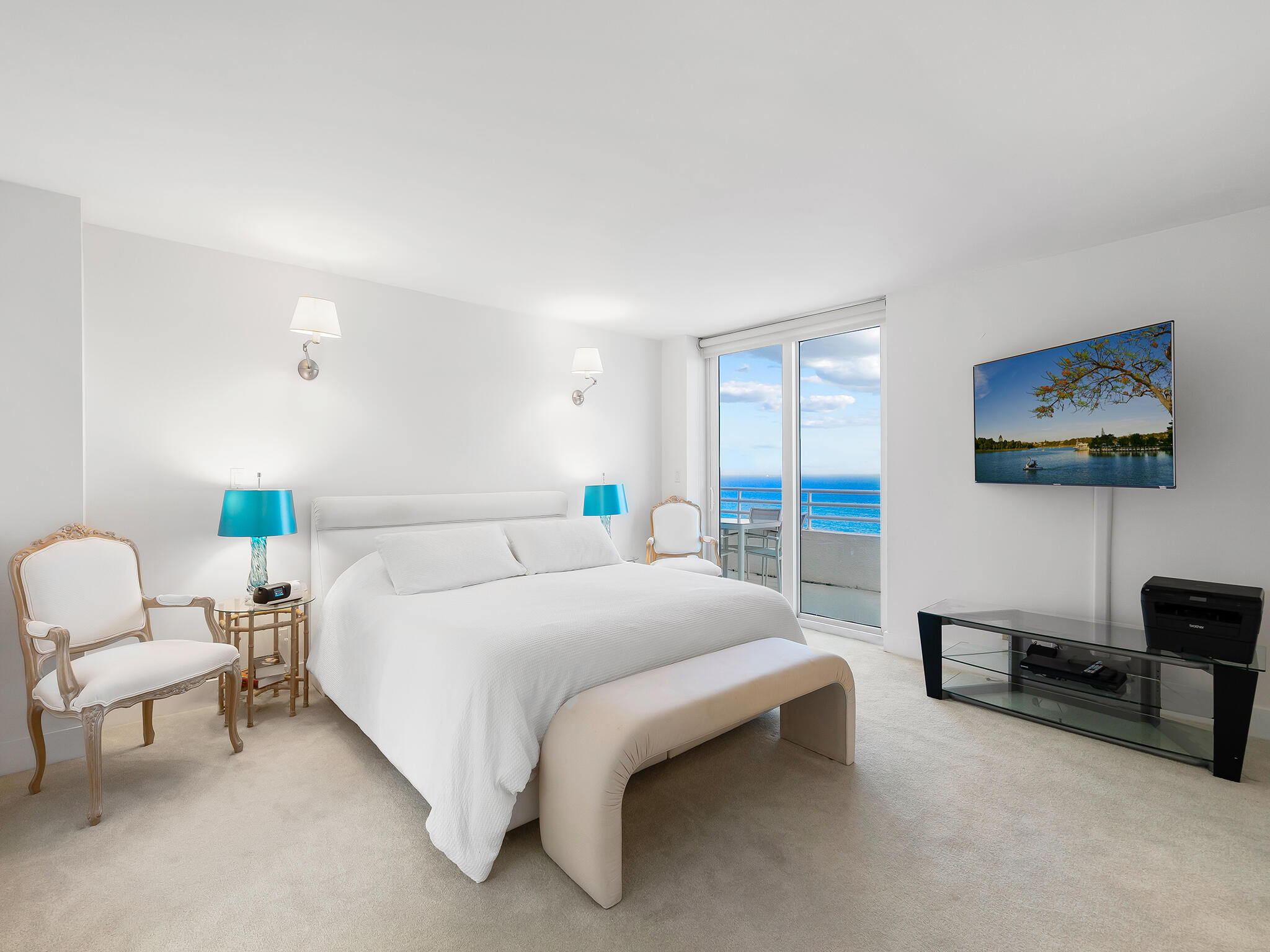 3407 South Ocean Boulevard, Unit PHB Highland Beach, FL 33487 - Photo 27 of 49 a bedroom with a bed and a couch