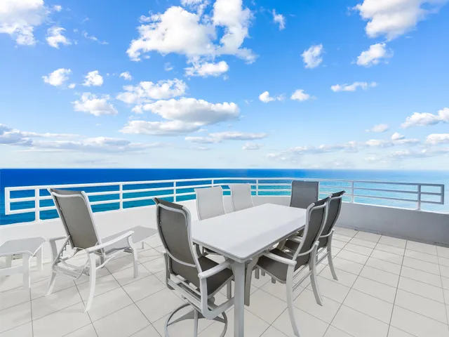a view of a terrace with furniture and stove