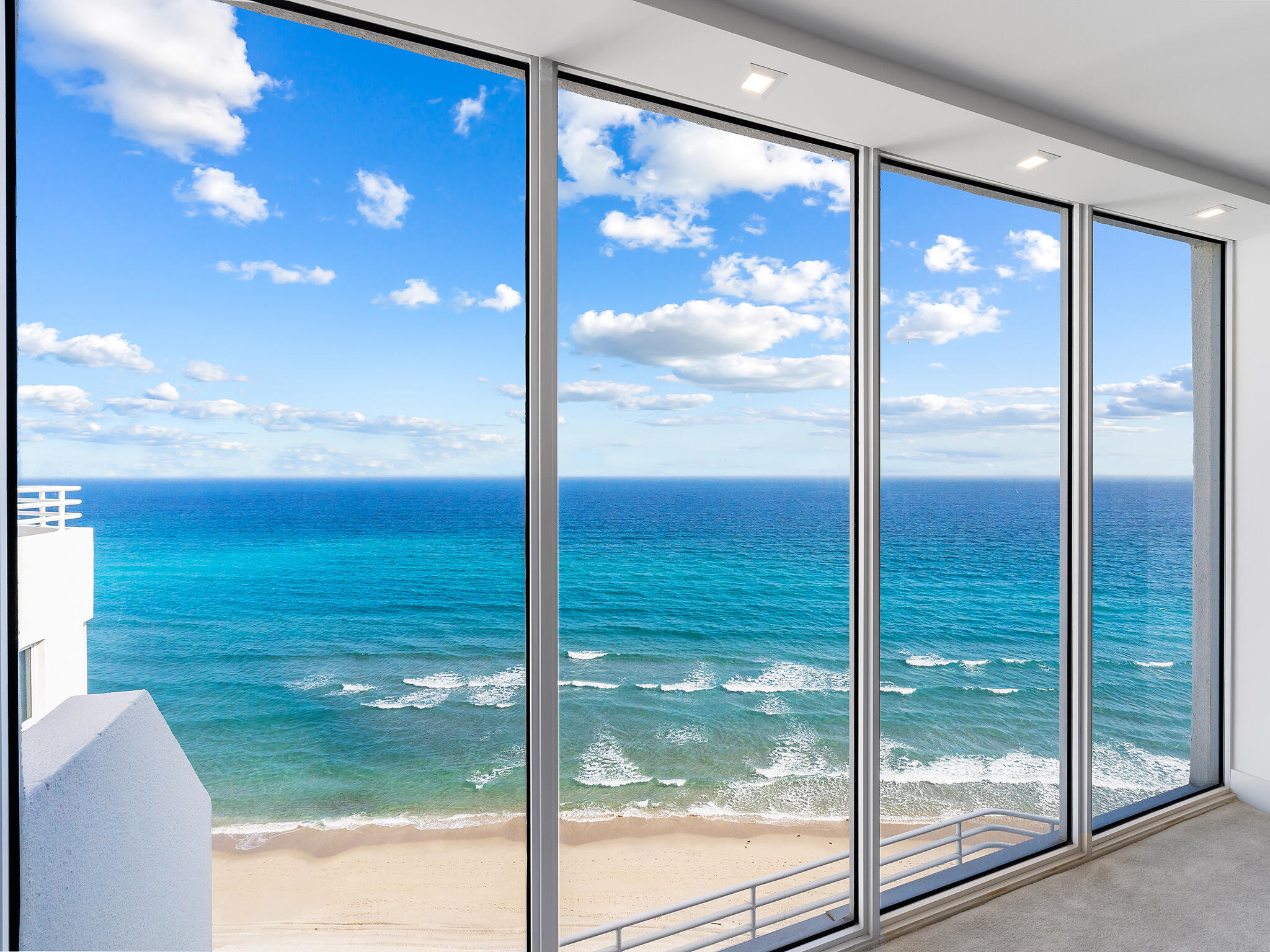 3407 South Ocean Boulevard, Unit PHB Highland Beach, FL 33487 - Photo 8 of 49 a view of a glass door and porch next to a yard