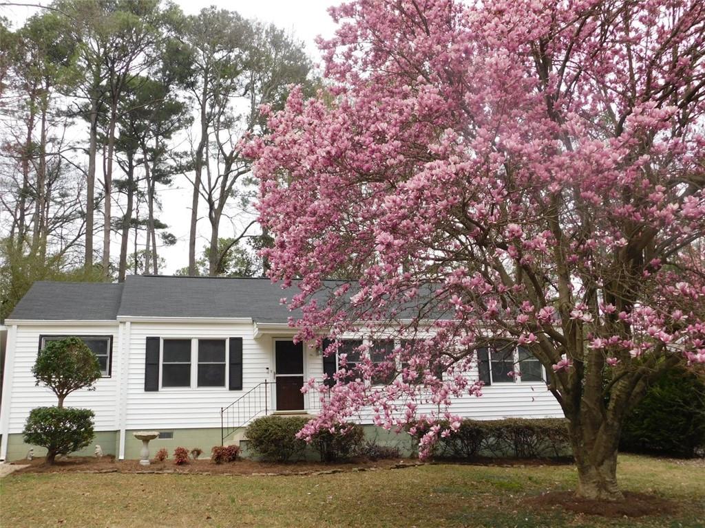 front view of house with a trees