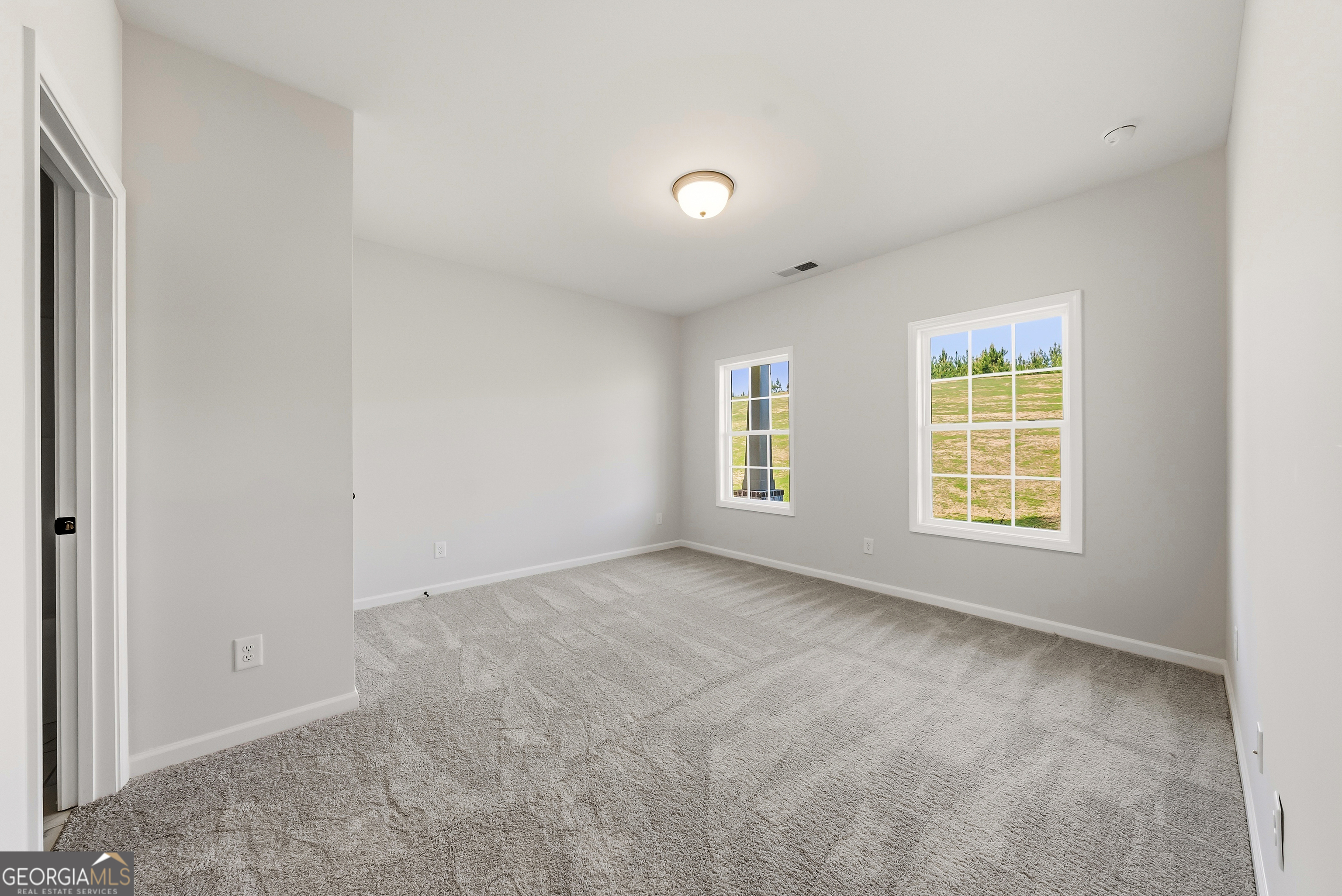 110 Hawkeye Trail, Unit 83 Fortson, GA 31808 - Photo 20 of 43 a view of an empty room with a window