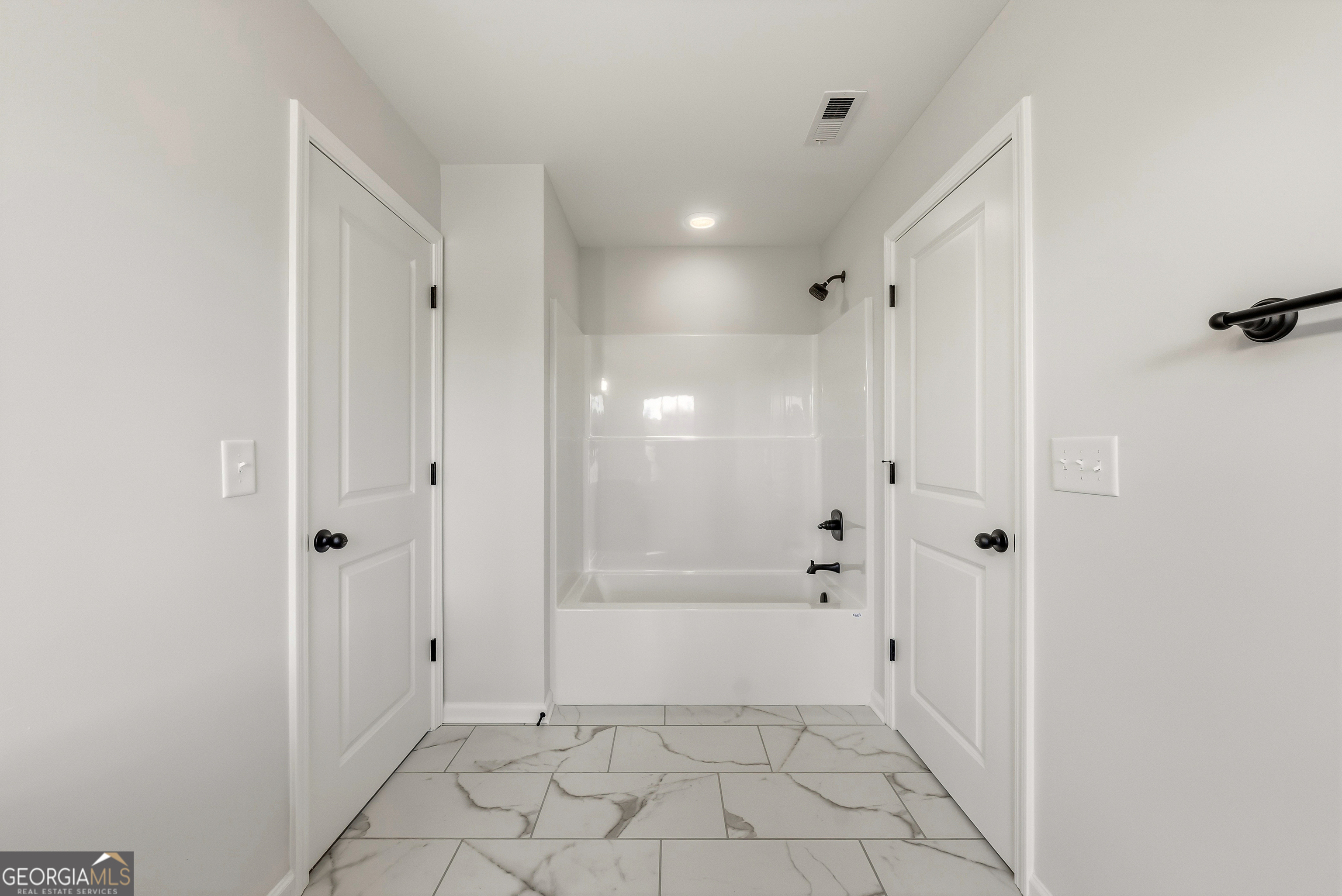 110 Hawkeye Trail, Unit 83 Fortson, GA 31808 - Photo 27 of 43 a bathroom with a bathtub and a shower