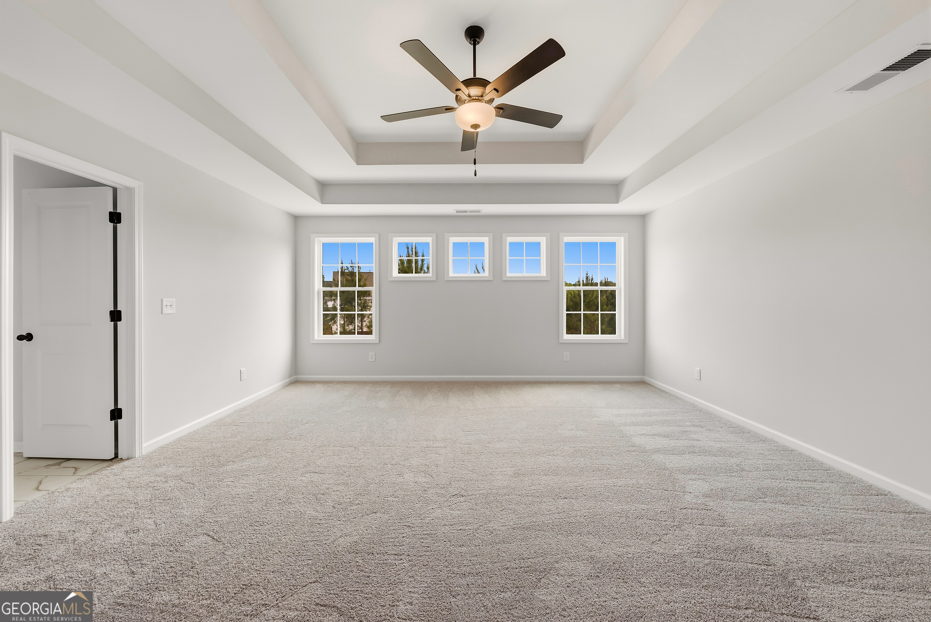 110 Hawkeye Trail, Unit 83 Fortson, GA 31808 - Photo 34 of 43 an empty room with ceiling fan and window