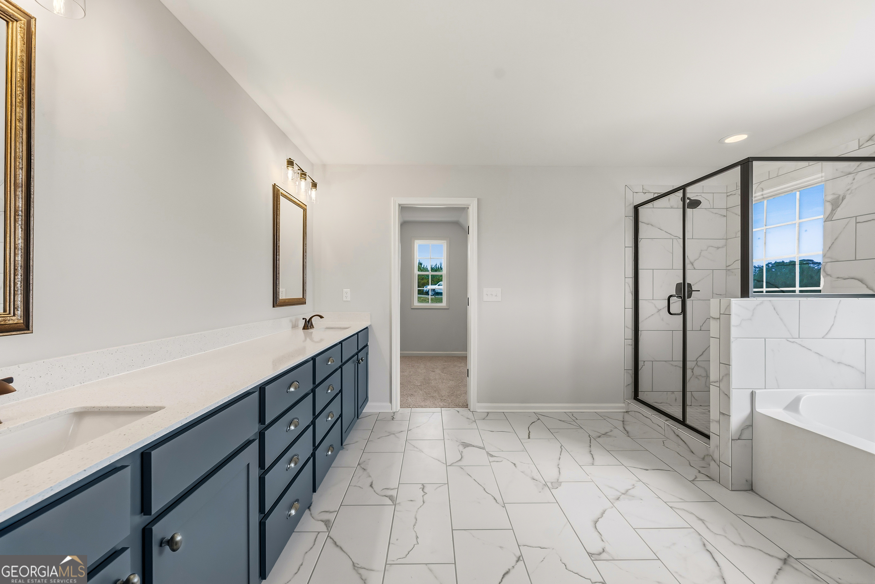 110 Hawkeye Trail, Unit 83 Fortson, GA 31808 - Photo 35 of 43 a bathroom with a sink a mirror and a bathtub
