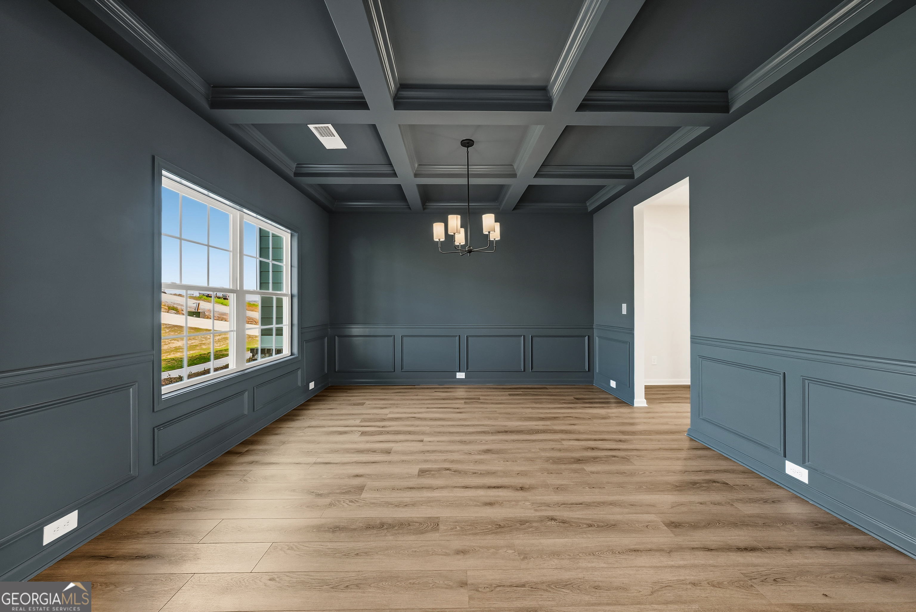 110 Hawkeye Trail, Unit 83 Fortson, GA 31808 - Photo 5 of 43 a view of empty room with wooden floor and fan