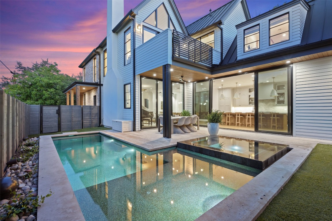 a view of a patio with swimming pool table and chairs