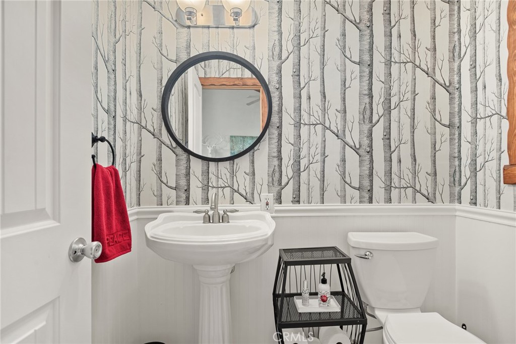 523 Dogwood Canyon Road Blue Jay, CA 92317 - Photo 13 of 33 a bathroom with a sink and a mirror