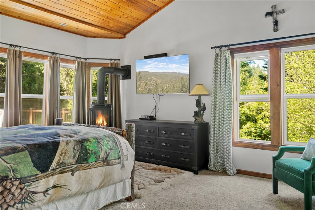 523 Dogwood Canyon Road Blue Jay, CA 92317 - Photo 14 of 33 a bedroom with a bed and a window