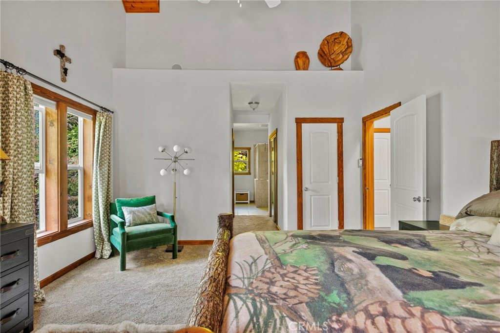 523 Dogwood Canyon Road Blue Jay, CA 92317 - Photo 16 of 33 a bedroom with a bed and a window